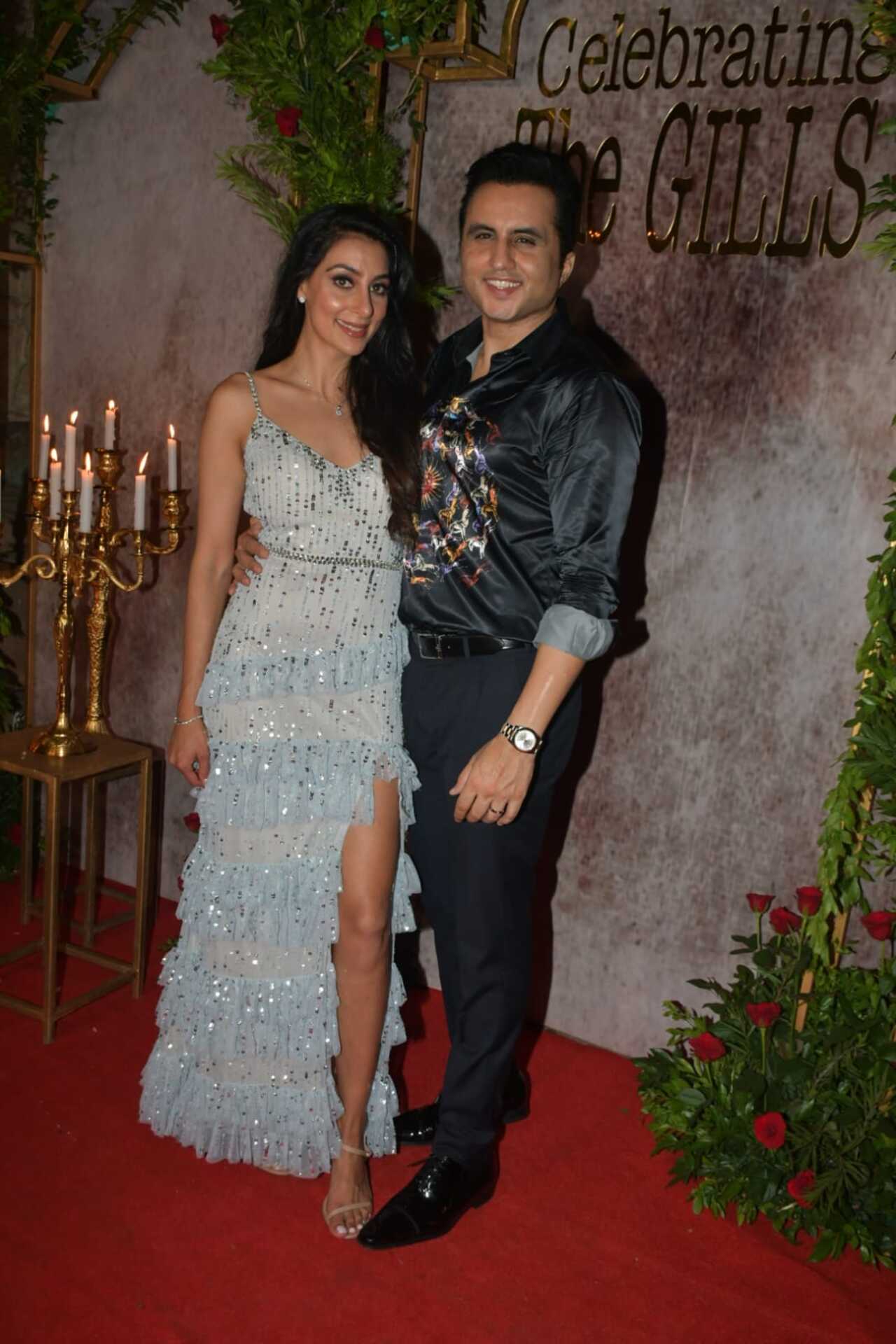 Aman Gill and Amrita greeted the media during their wedding party. He looked dapper in a printed shirt. She looked stunning in a gown
